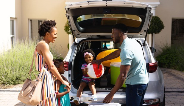 Family packing car for road trip